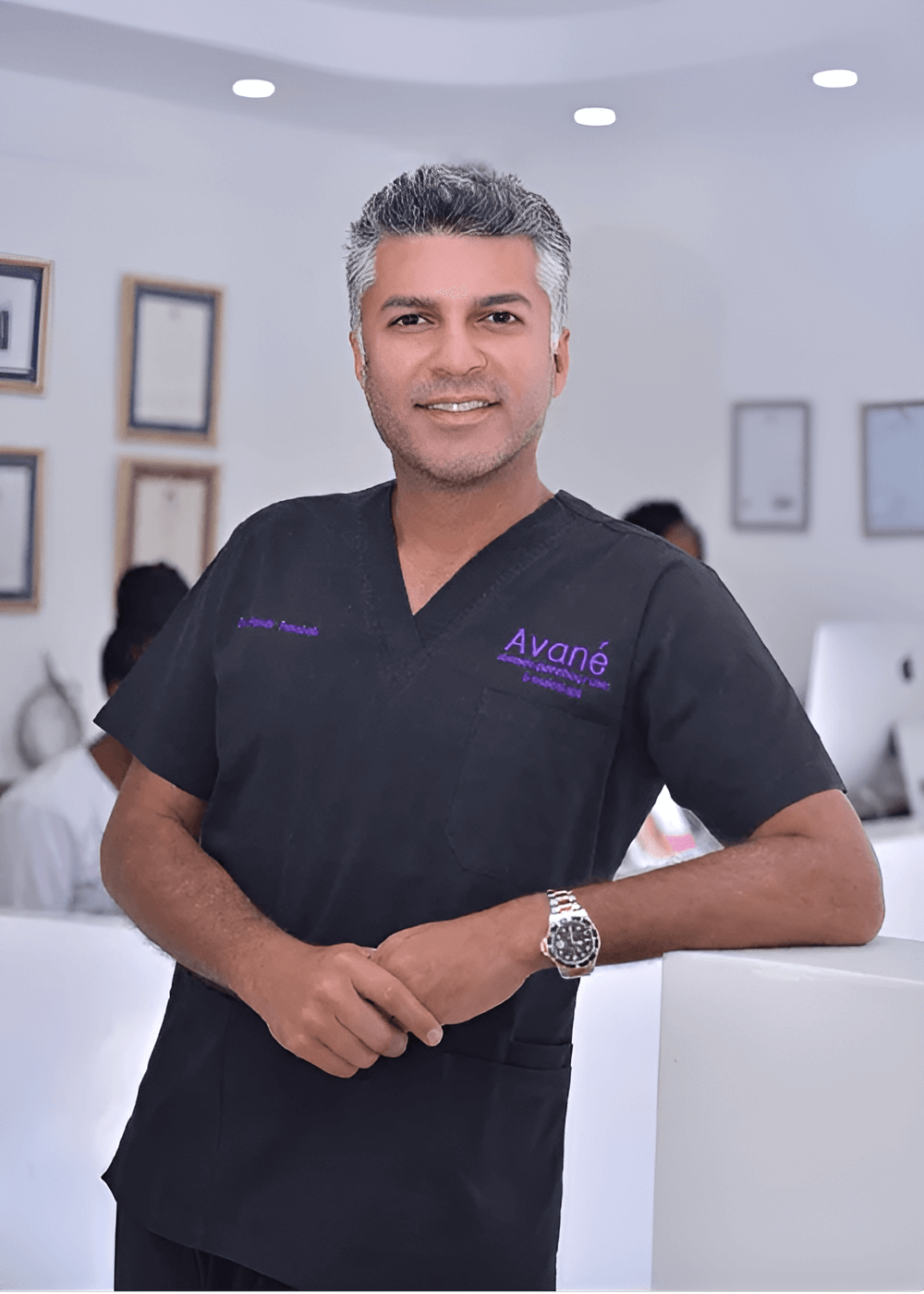 Healthcare professional smiling in clinic environment.