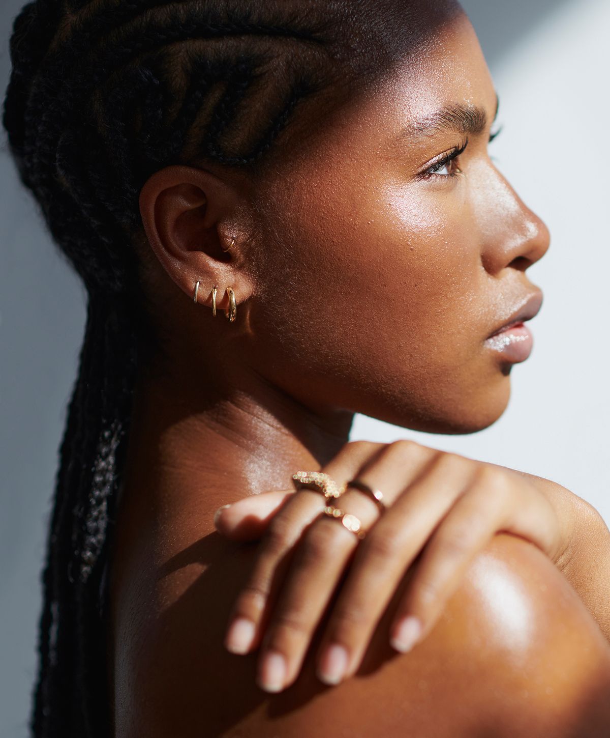 Portrait of a young woman with braided hair.