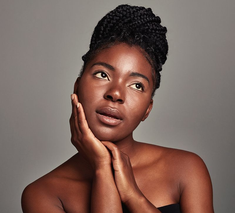 Portrait of a woman with braided hairstyle.