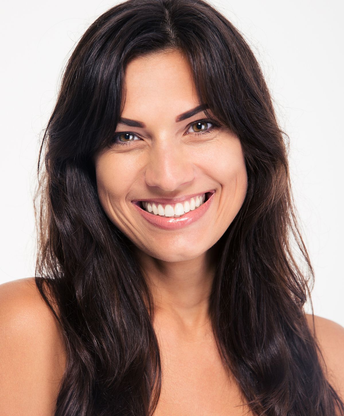 Smiling woman with long dark hair.