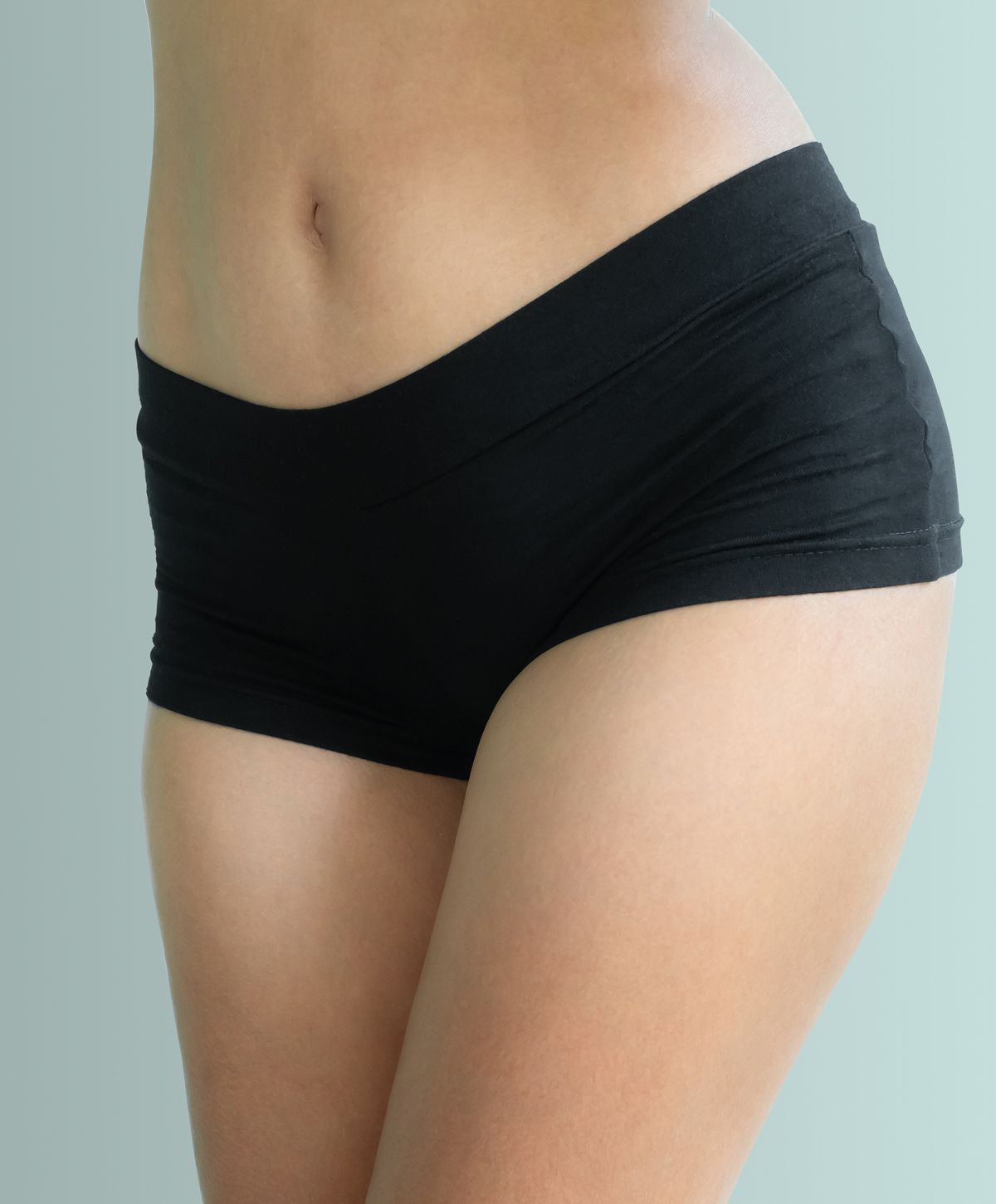 Portrait of a woman with freckles and blue eyes.